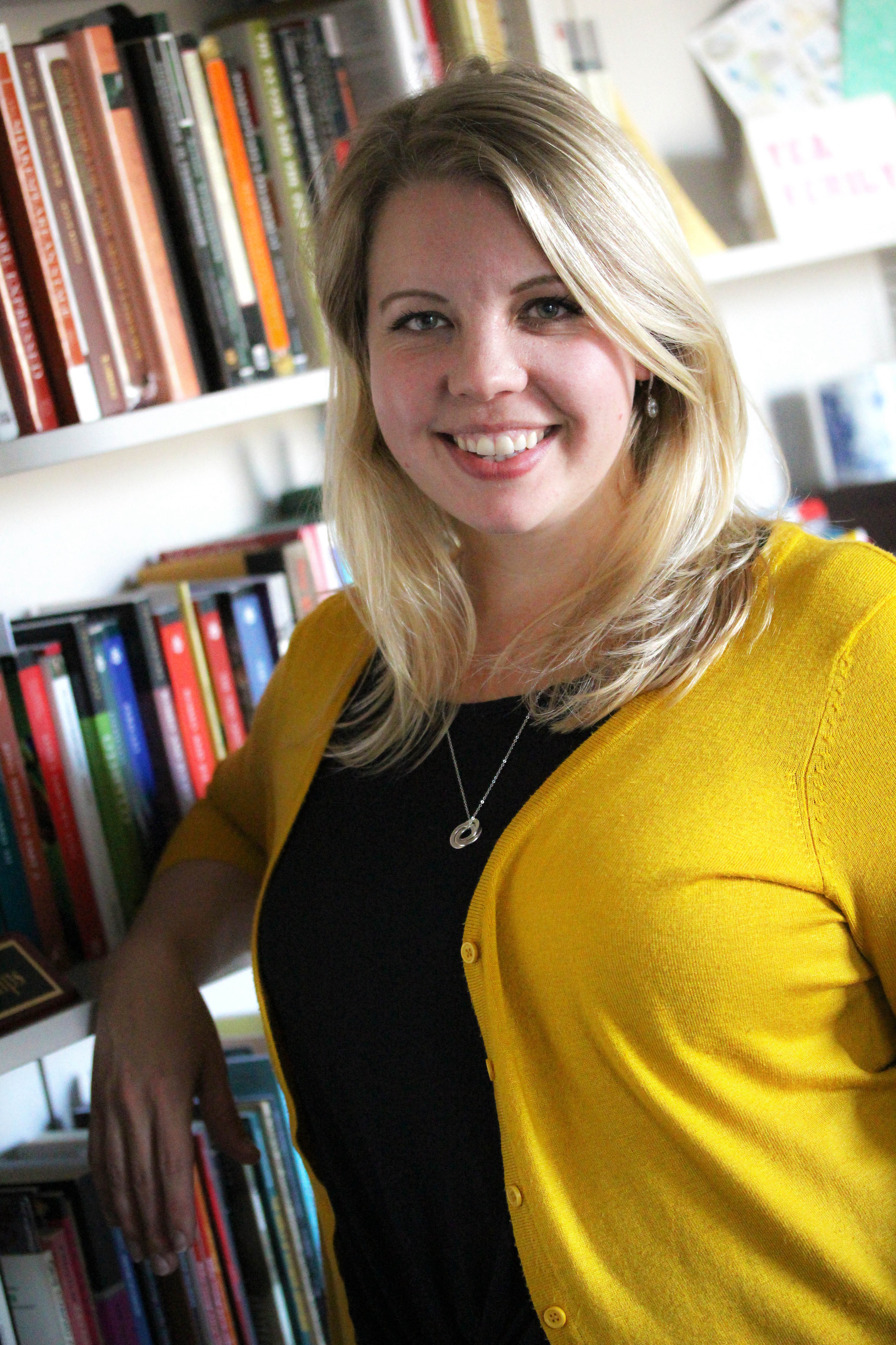 Headshot of Chelsea Phillips in front of bookcase