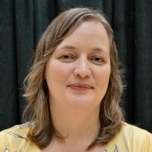 Headshot of Fiona Ritchie in front of curtain
