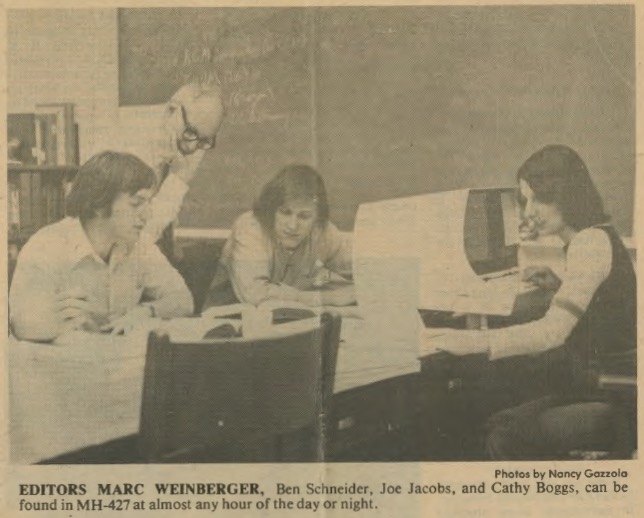 newspaper photograph of editors in a classroom at work on the London State Information Bank. Caption states: Photos by Nancy. Editors MARC WEINBERGER, Ben Schneider, Joe Jacobs, can be found in MH-427 at almost any hour of the day or night.